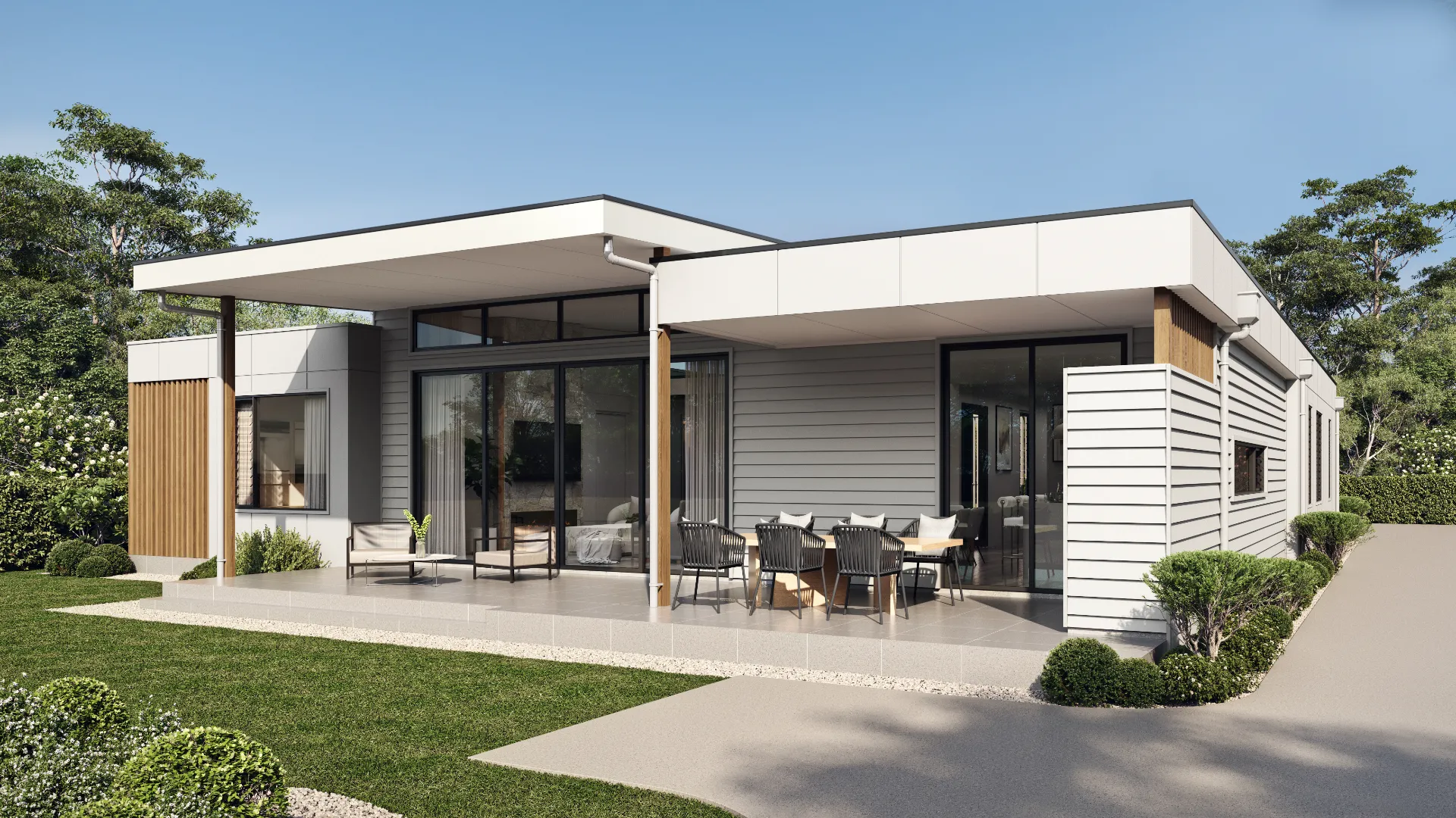 Rear of a contemporary home with an outdoor dining terrace
