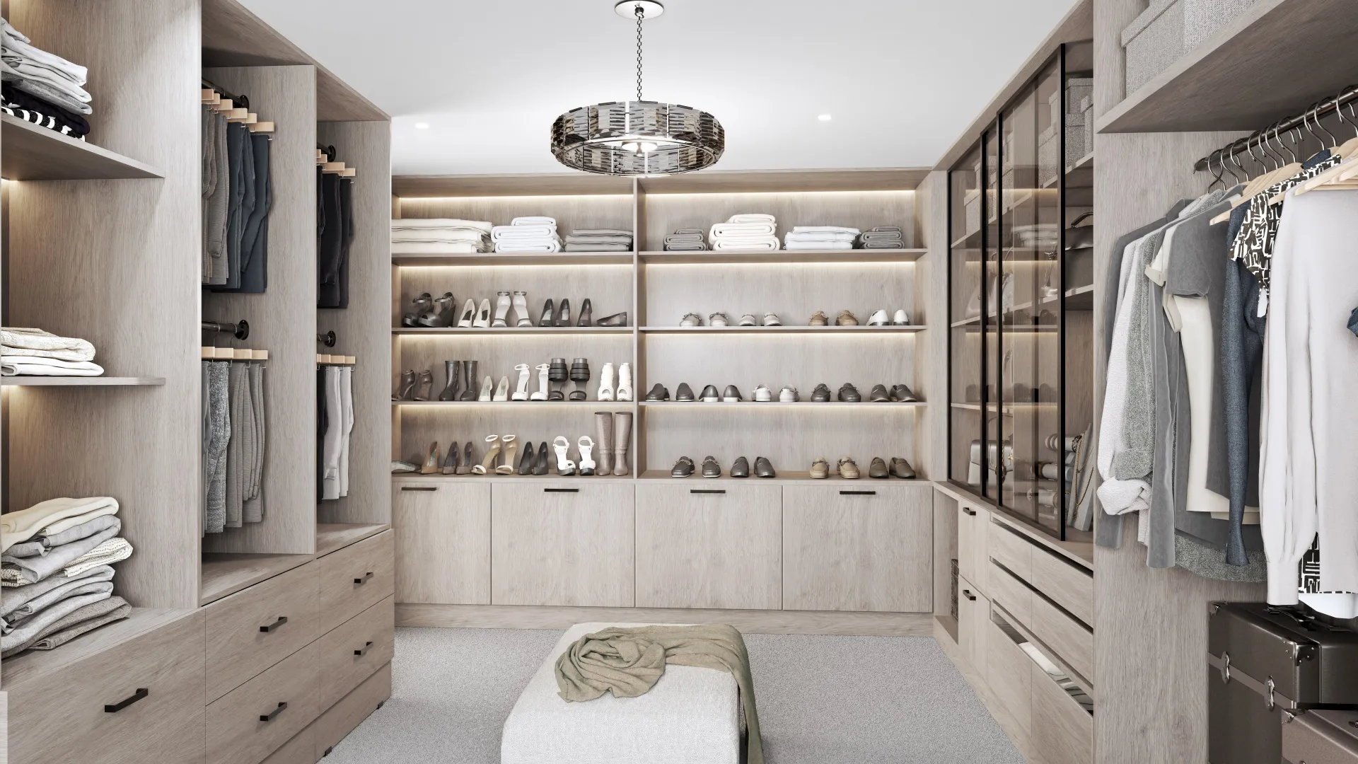 walk-in closet with lit open shelving and a chandelier